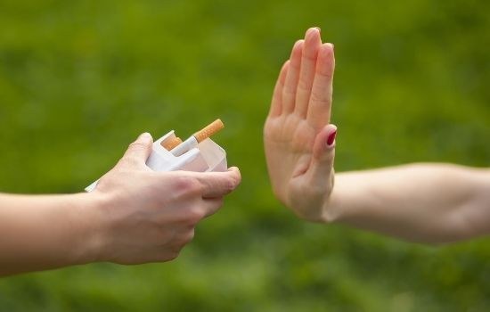 hand up to stop smoking tobacco as a way to reduce risk if lung cancer