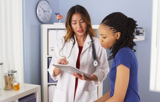 woman consulting oncologist about a triple negative breast cancer diagnosis