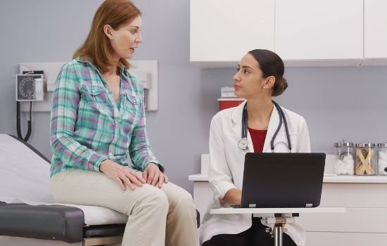 woman consulting head and neck cancer doctor questions to ask