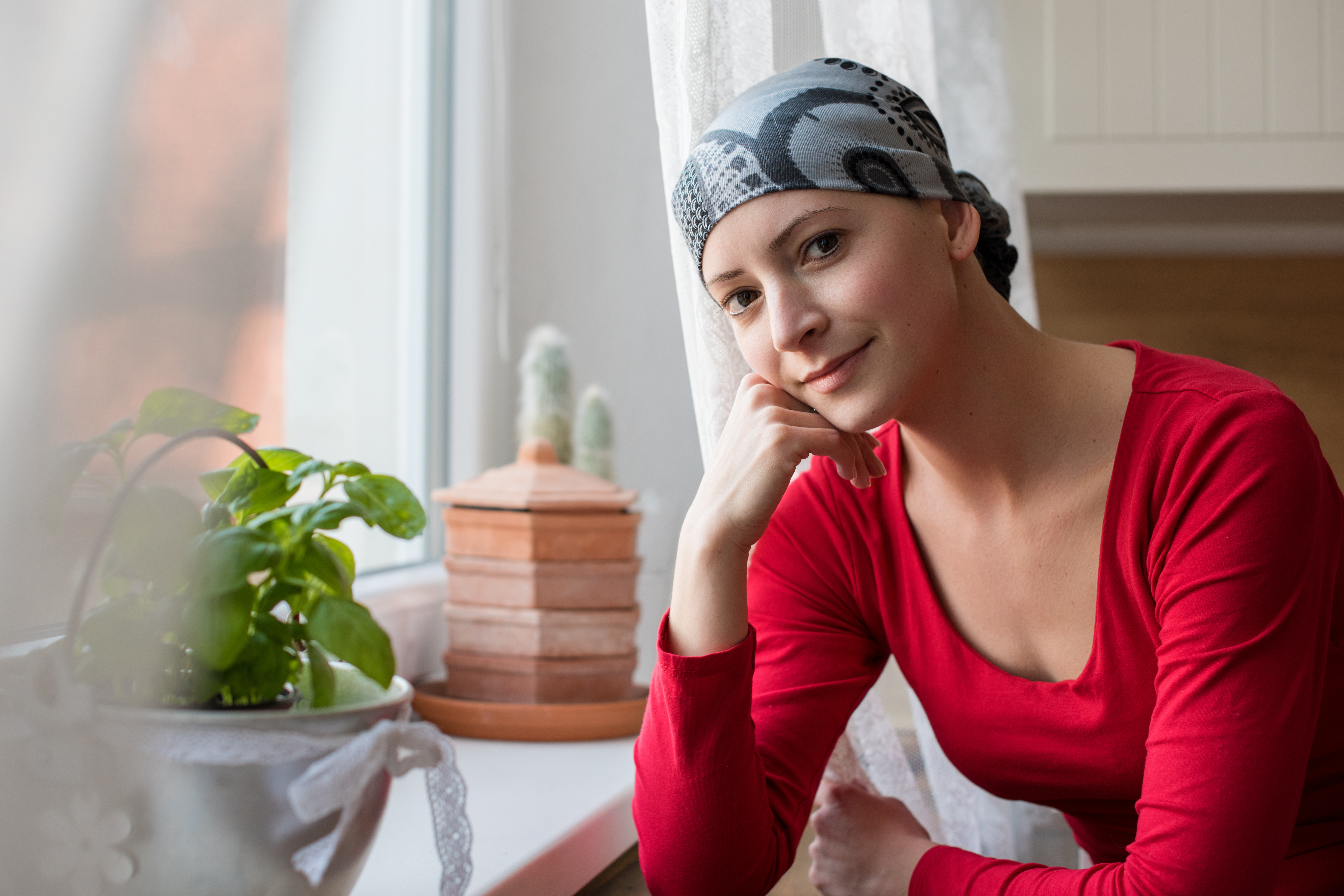 young woman wearing red shirt - Colorectal Cancer and Young Adults: Cause for Concern?