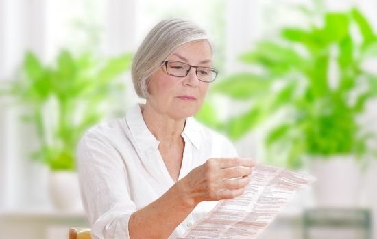 woman reading about at home colorectal cancer tests